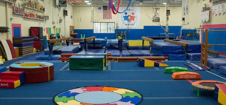 Exxcel facility exterior and training spaces